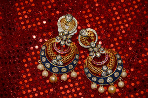 Something to go with your Garba night couture. Also wear with saris, suits and kurtis. This colorful pair of earrings is a traditional work of art, only for you.